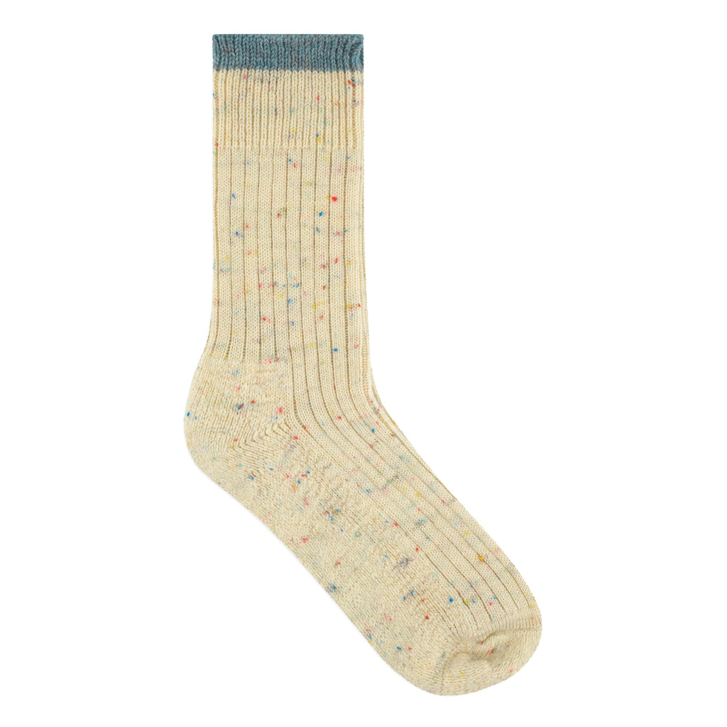 Beige sock with multicolor speckles on a white background
